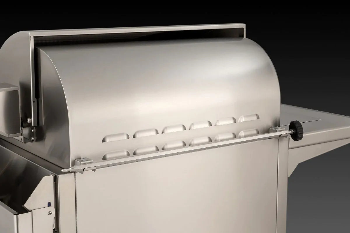 Stainless steel grill hood and control knobs with burner area in view