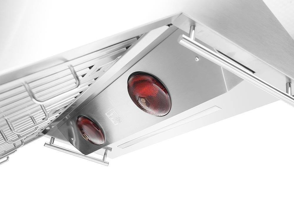 Under-hood view of two red warmer lamps with stainless reflector housings