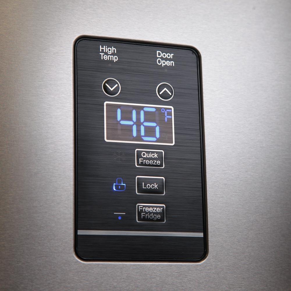 Refrigerator door control panel with digital temperature display and buttons