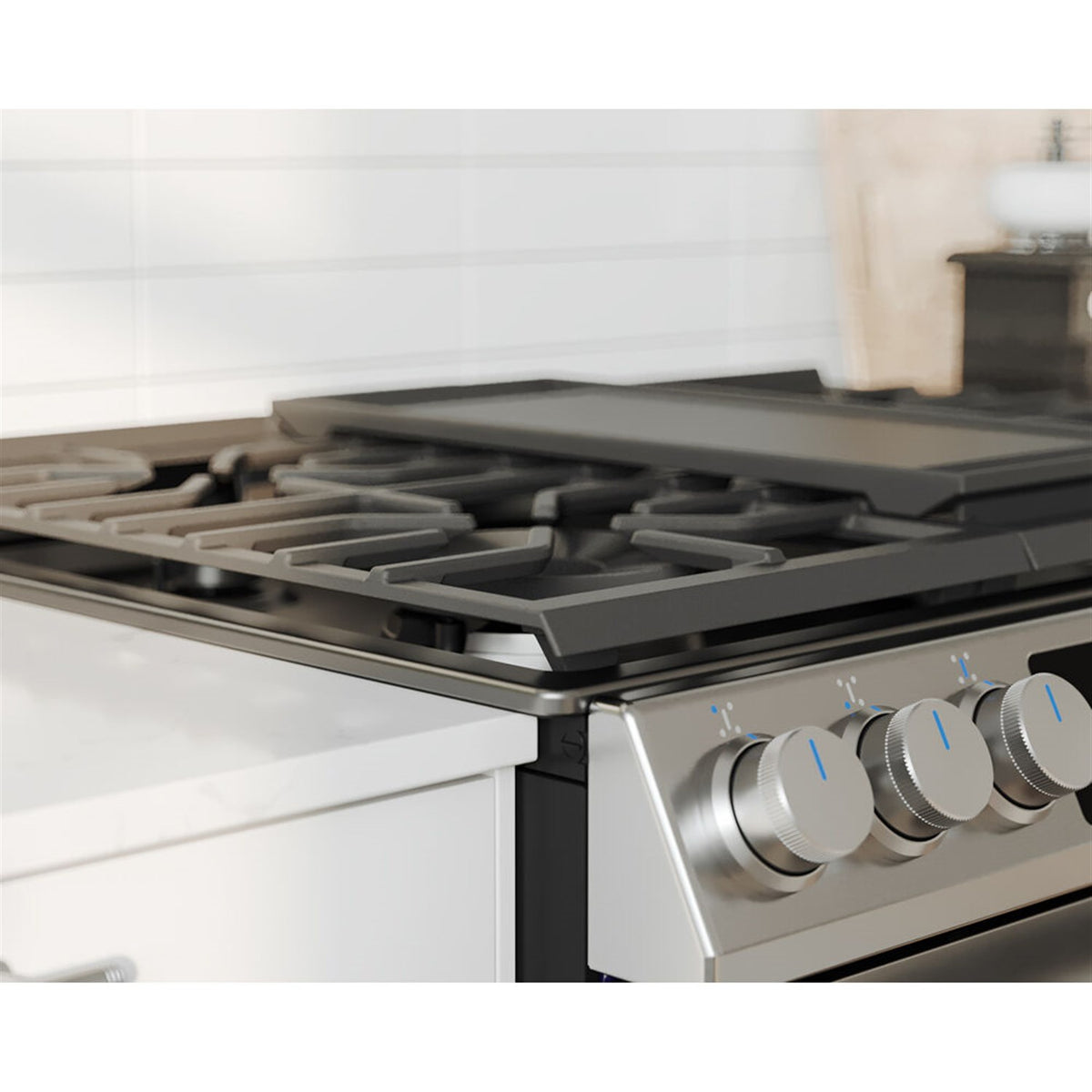 Stainless steel gas range cooktop grates and control knobs with burner area