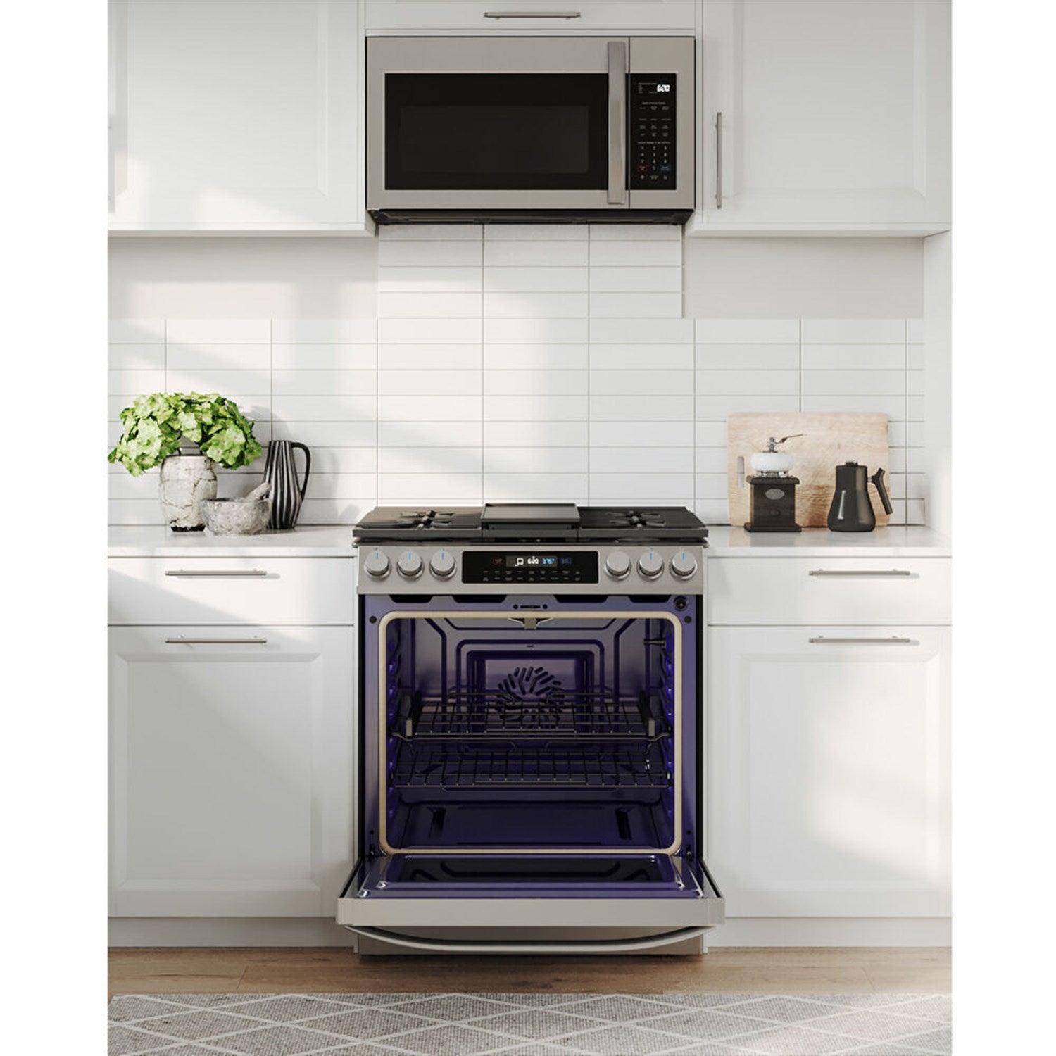 Stainless steel slide-in gas range with open oven door showing dark interior racks