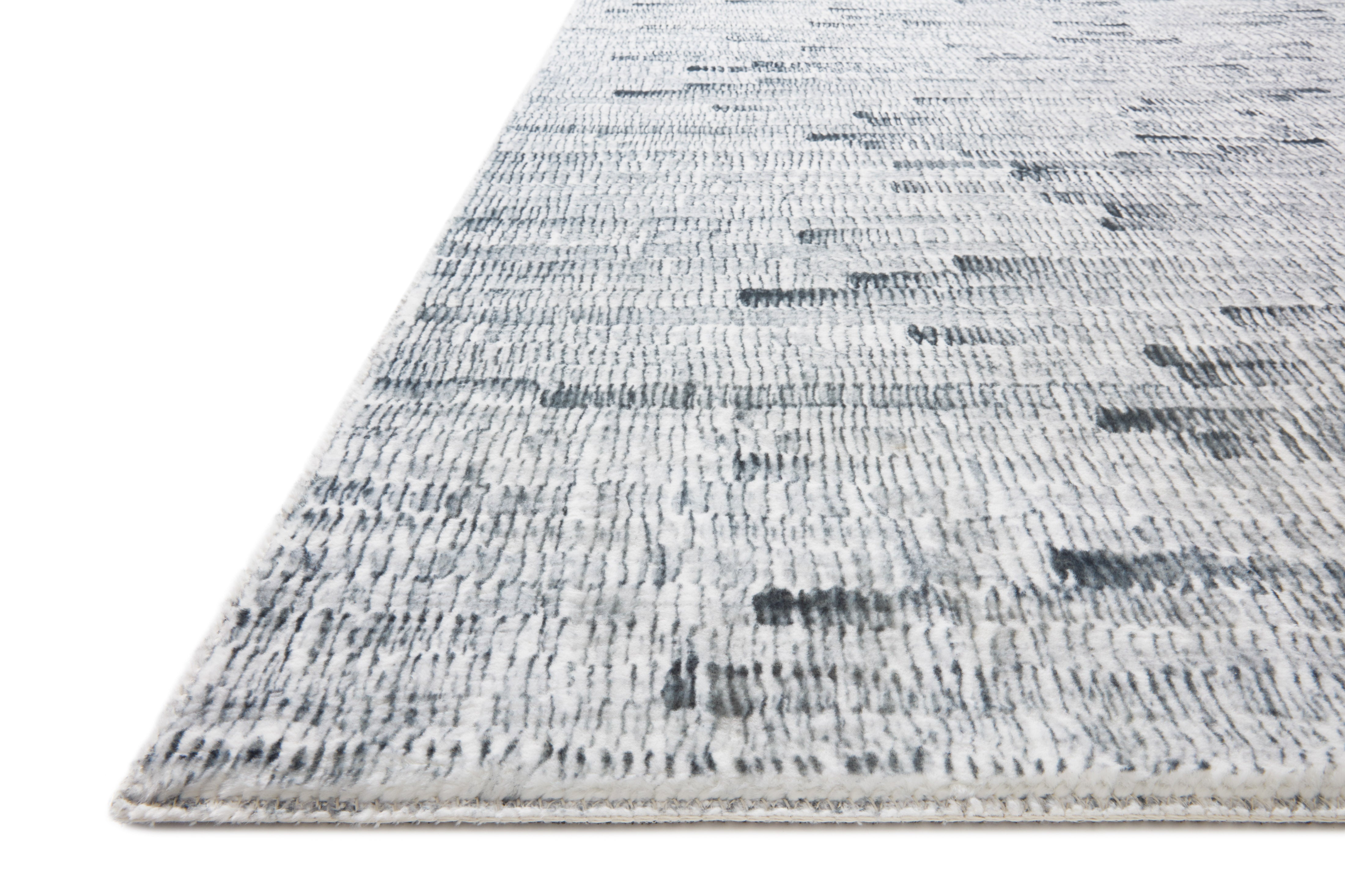 Silver and white polyester pile rug with abstract distressed stripe pattern