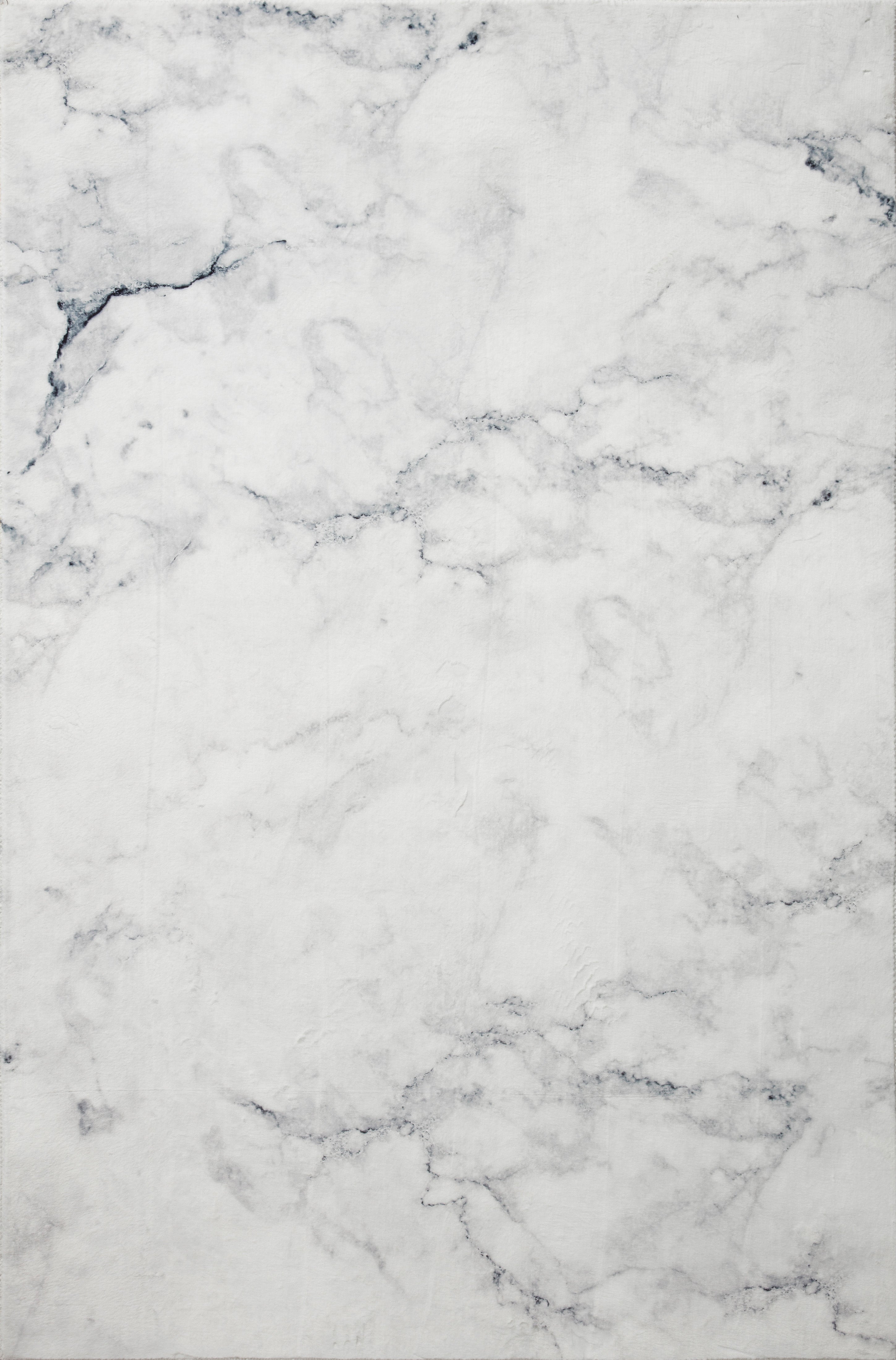 Ivory hand-tufted rug close-up with blue-gray marble print