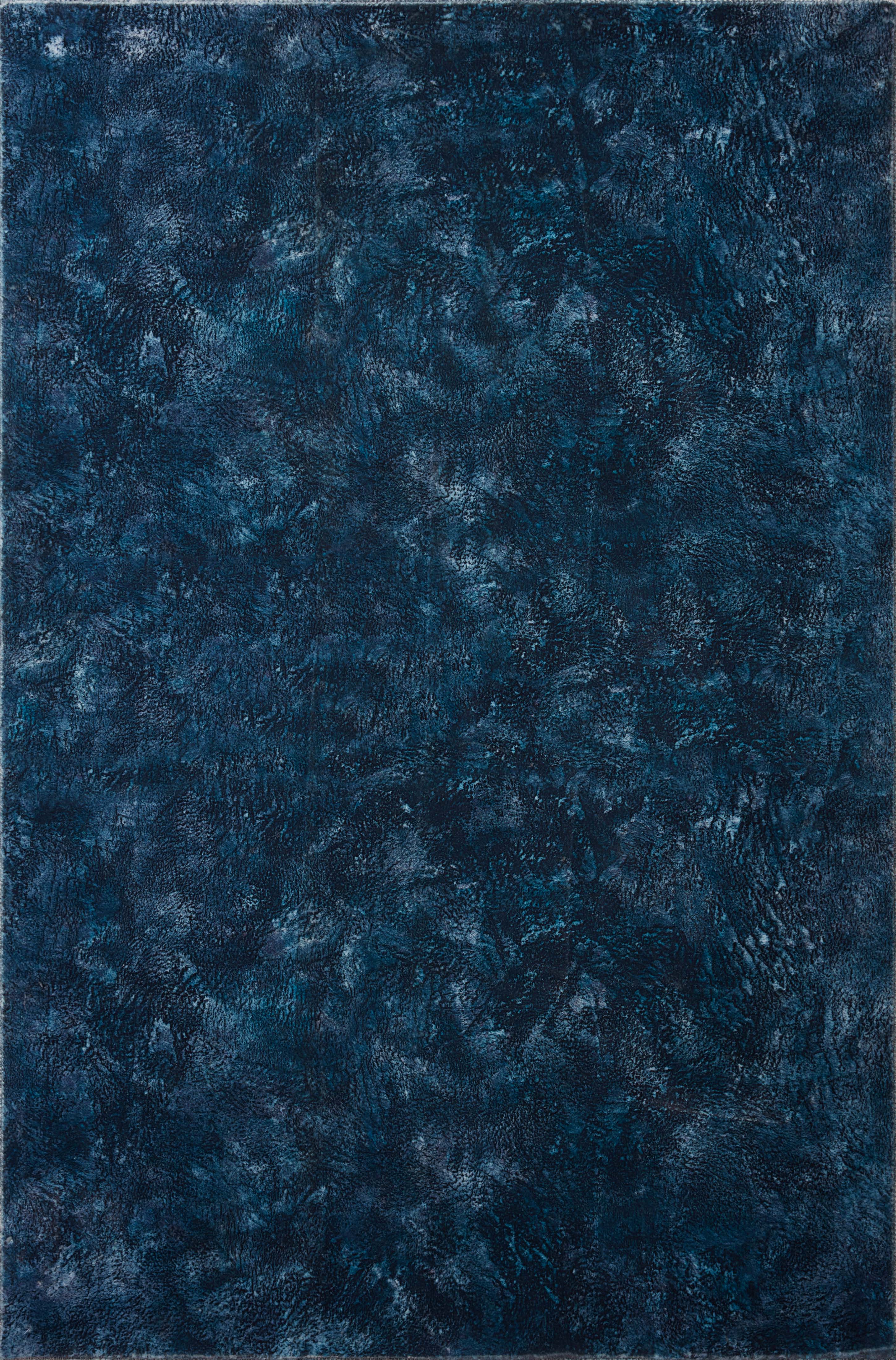 Contemporary power-loomed rug with mottled abstract design in midnight blue tones