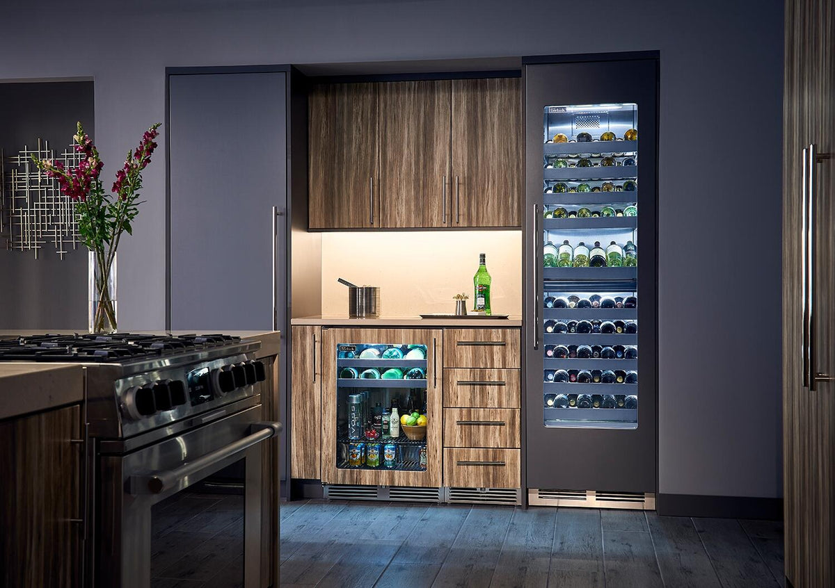 Panel-ready built-in wine cooler with open door, dual shelves, and bottle storage