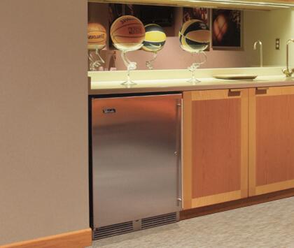 Built-in compact freezer installed under counter with stainless door and handle