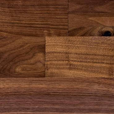 Walnut butcher block wood sample board with warm brown grain, rectangular piece
