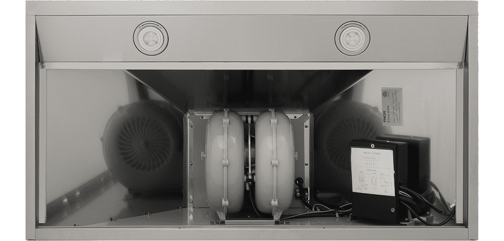 Range hood interior with twin blowers and electrical components