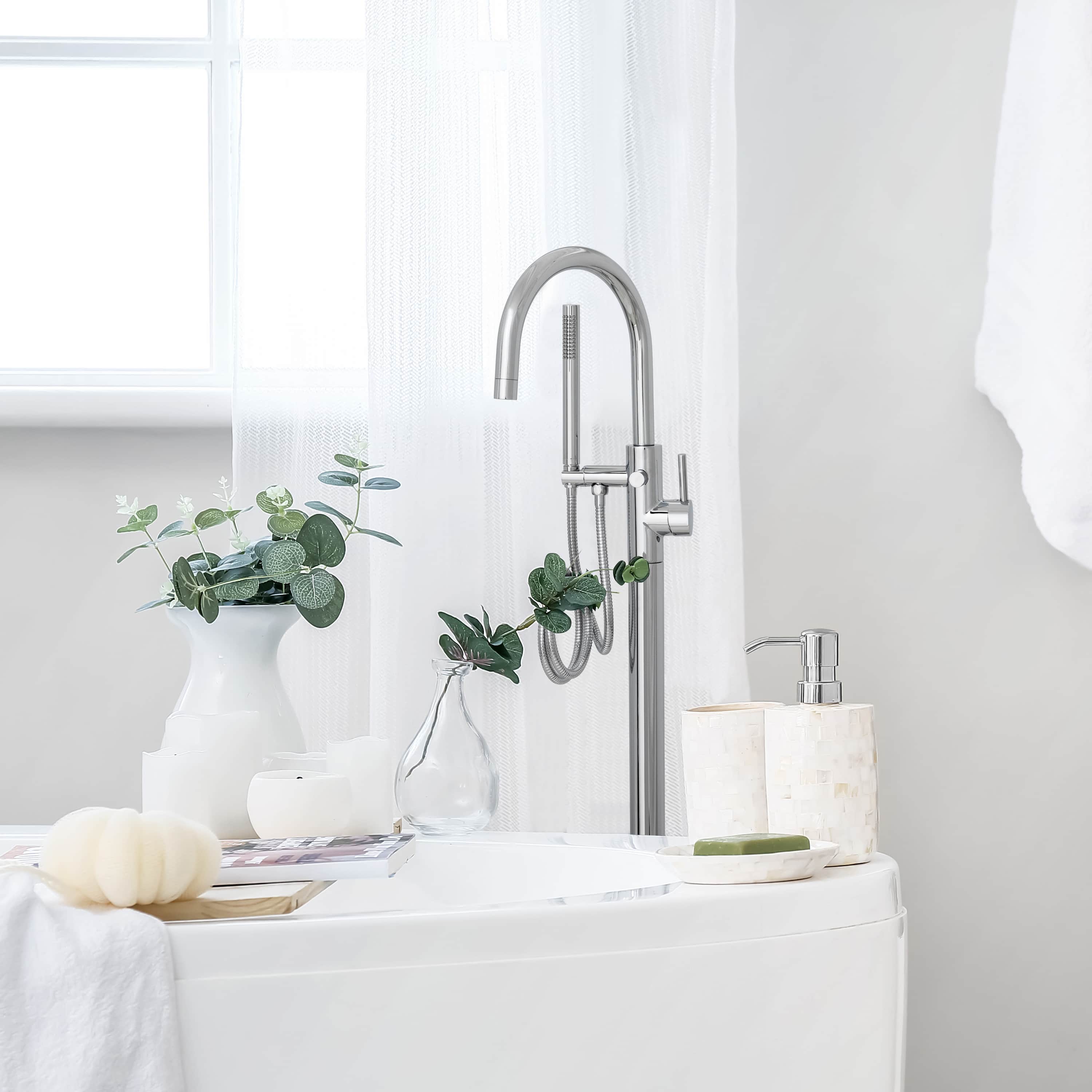 Chrome bath tub filler with tall arched spout and two handle controls