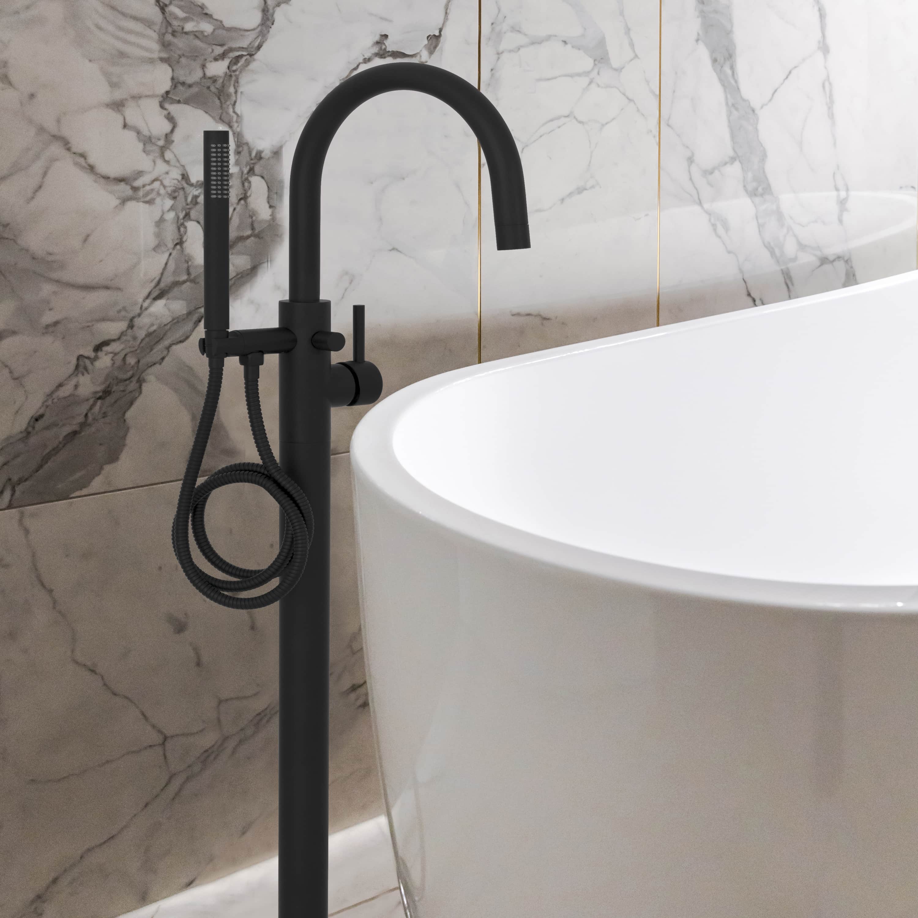Matte black floor-mounted tub filler with curved spout and braided hand shower hose