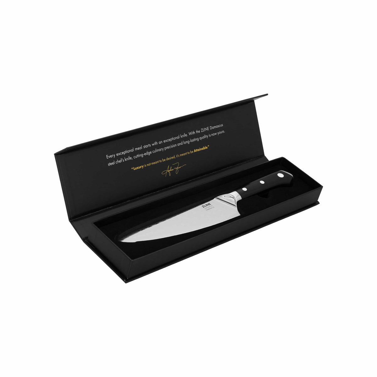 Damascus chef’s knife in open packaging with black handle and patterned blade