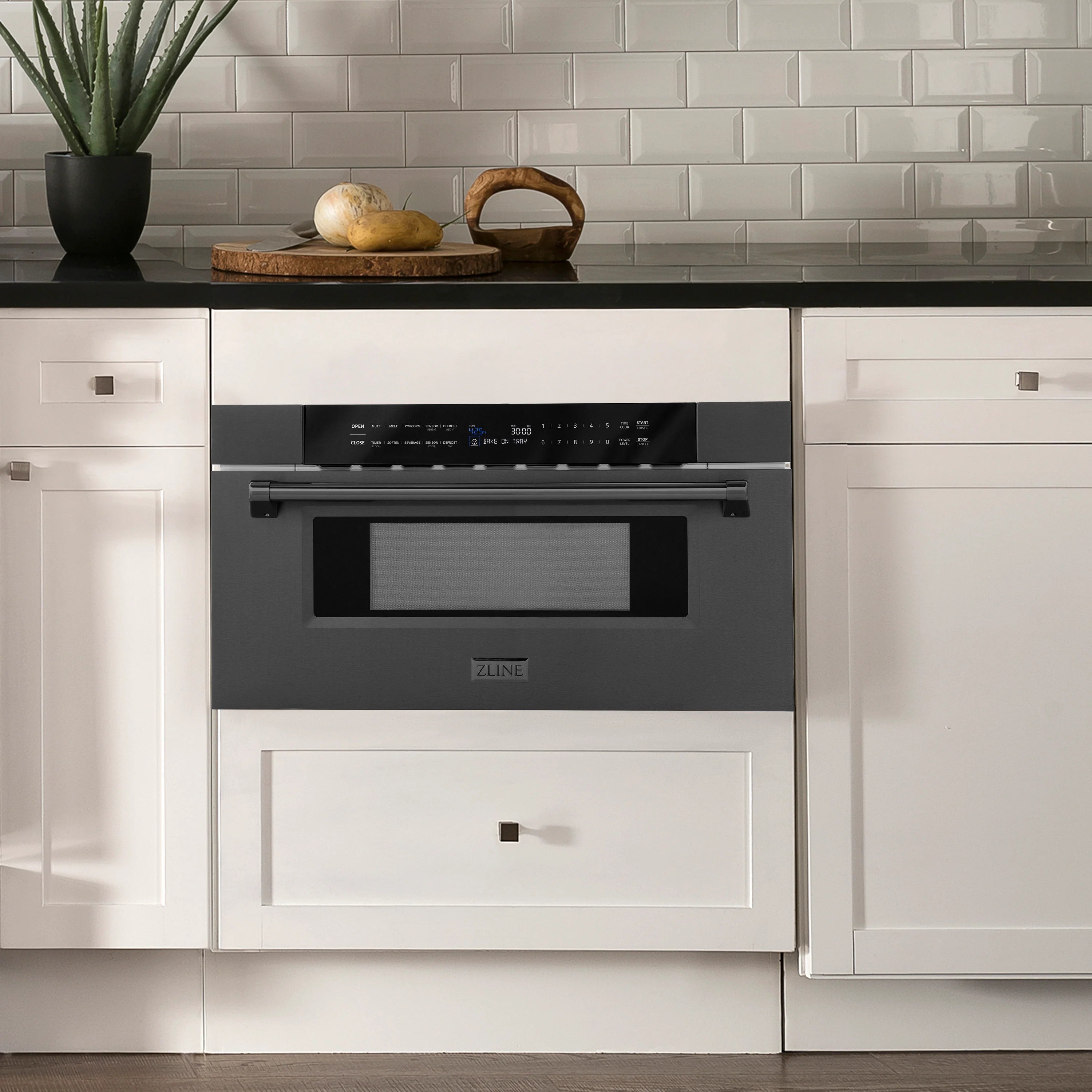 ZLINE built-in microwave drawer in black stainless, installed in kitchen cabinet