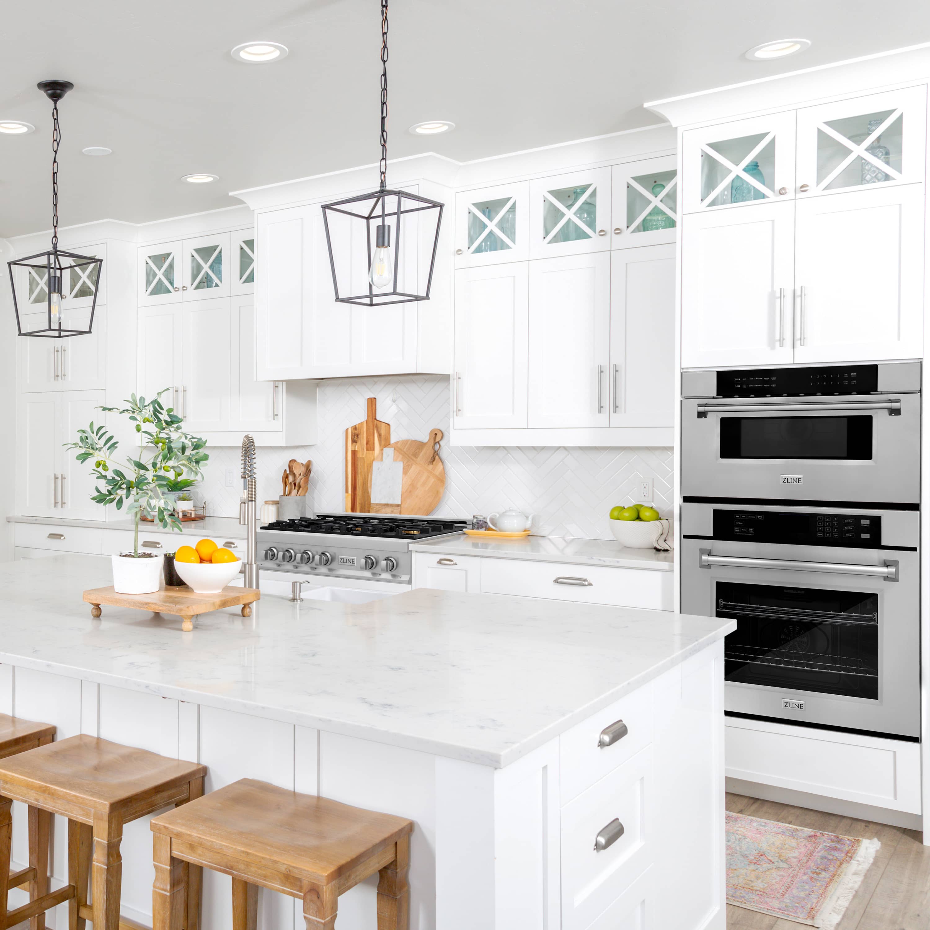 Built-in microwave drawer in stainless steel installed in a kitchen cabinet with black display