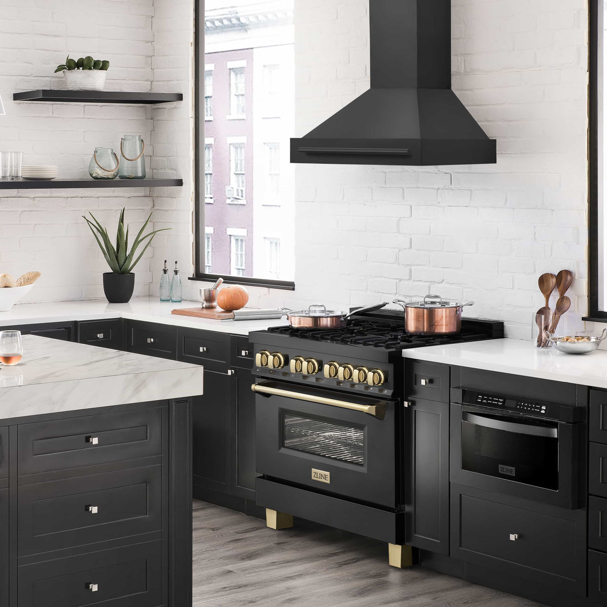 Wall-mount range hood in black stainless with tall chimney and flat canopy.