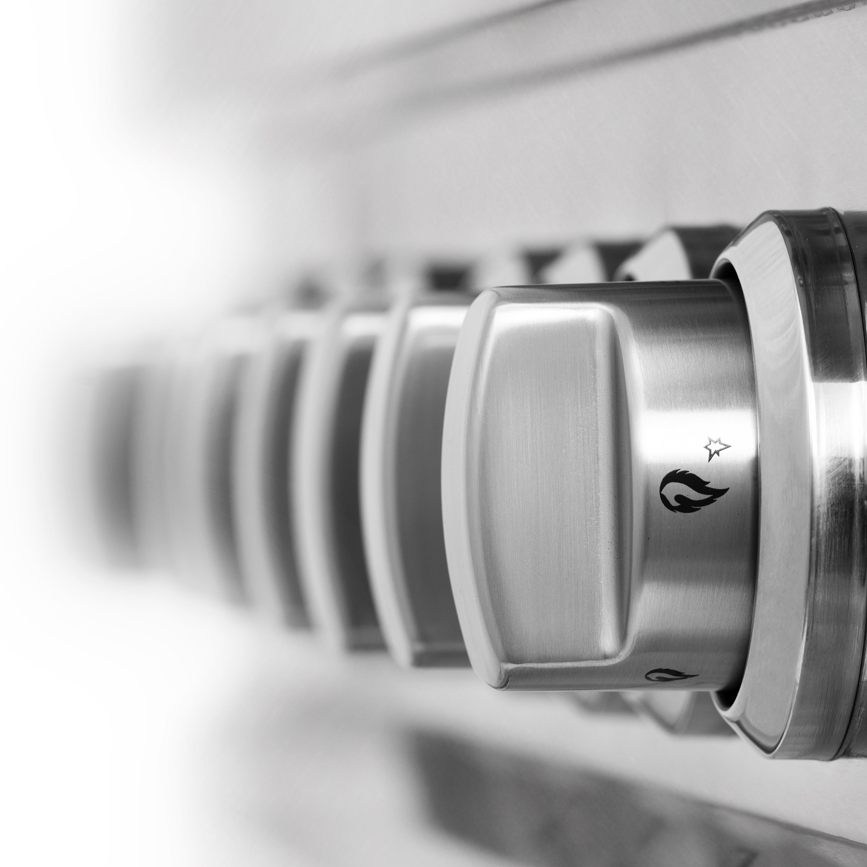 Satin stainless steel control knobs with smooth rocker-style trim