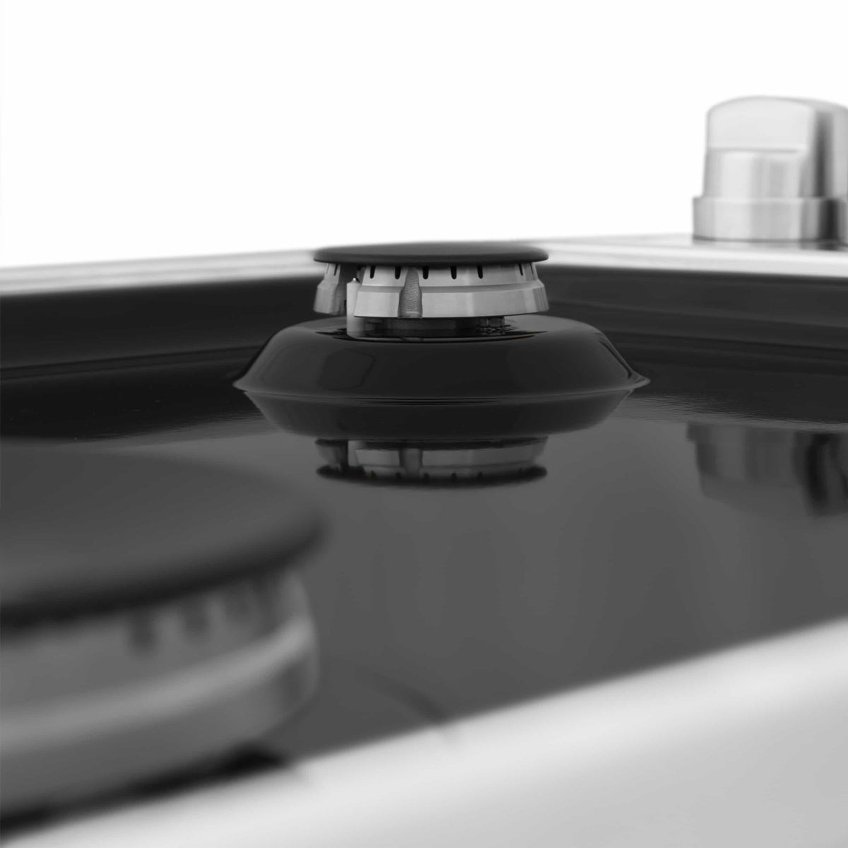 Black gas burner cap on a ZLINE black porcelain cooktop surface