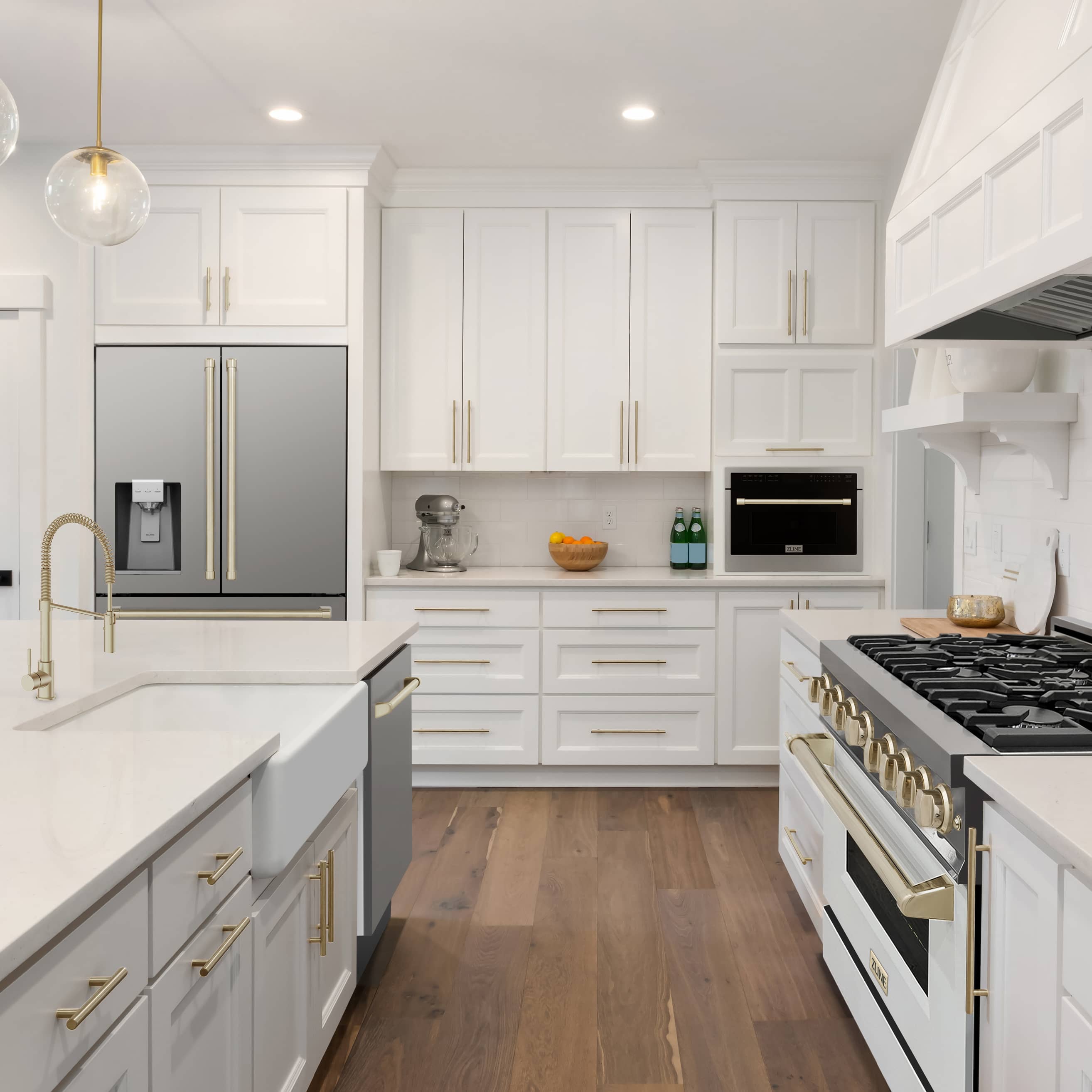 Kitchen appliance setup with stainless refrigerator and gold-accent gas range