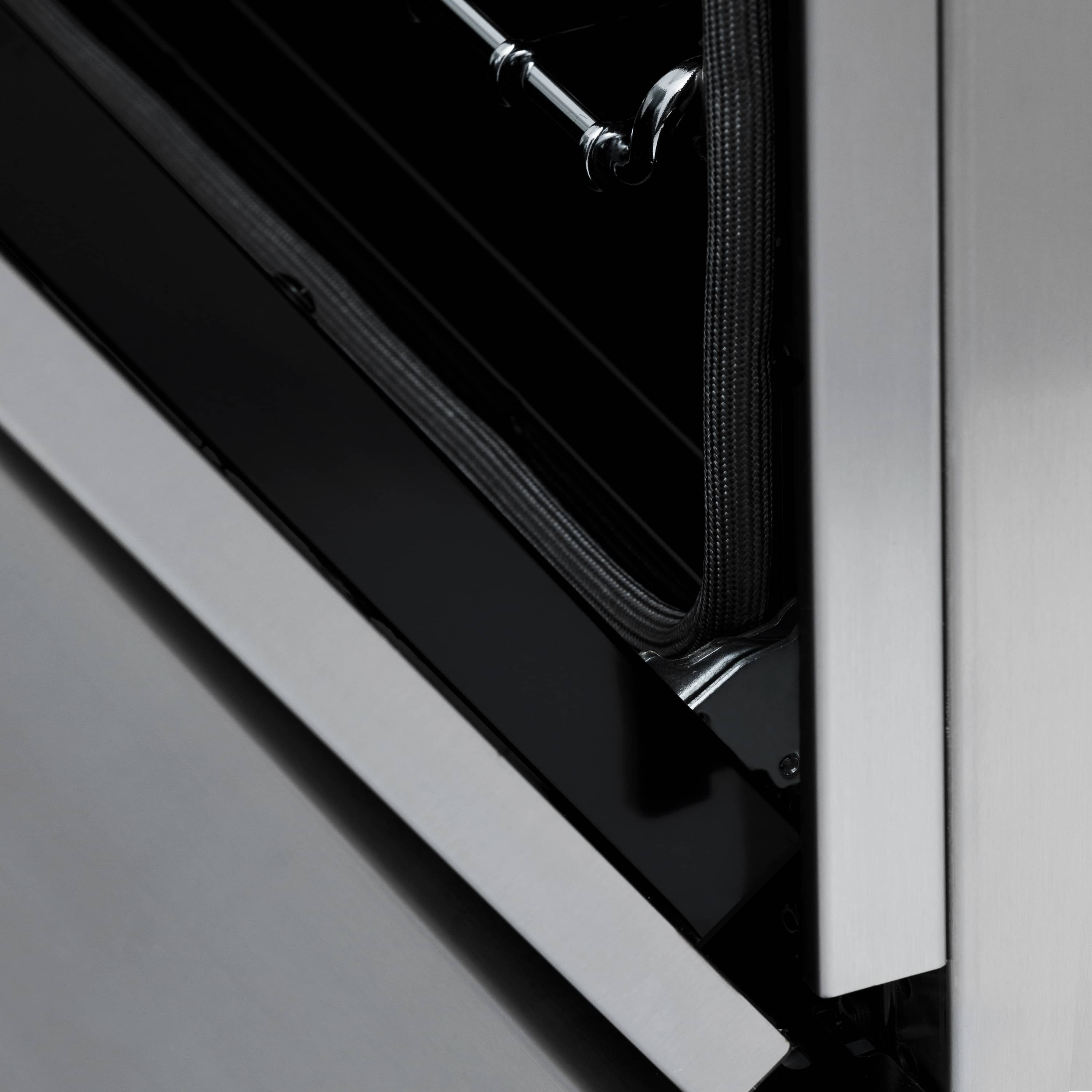 Stainless dual fuel range oven door opening with black inner panel