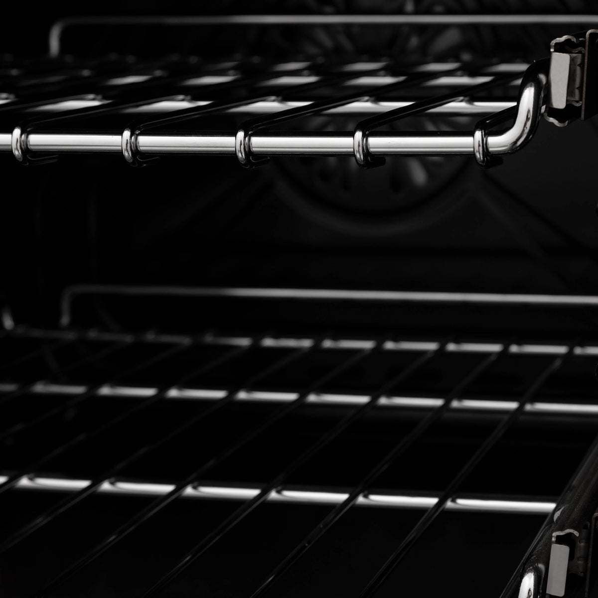 Oven interior with chrome racks and black back panel