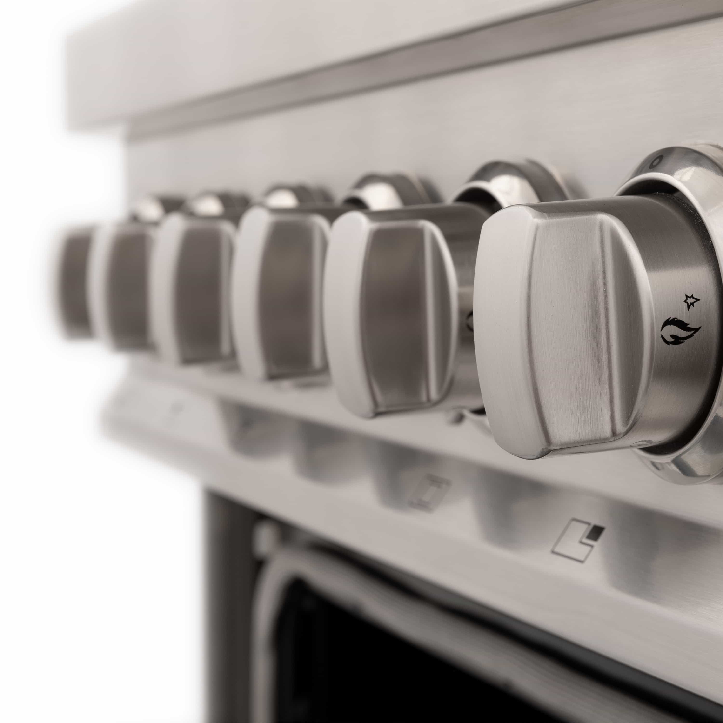 Dual fuel range control knob row with brushed stainless knobs on front panel