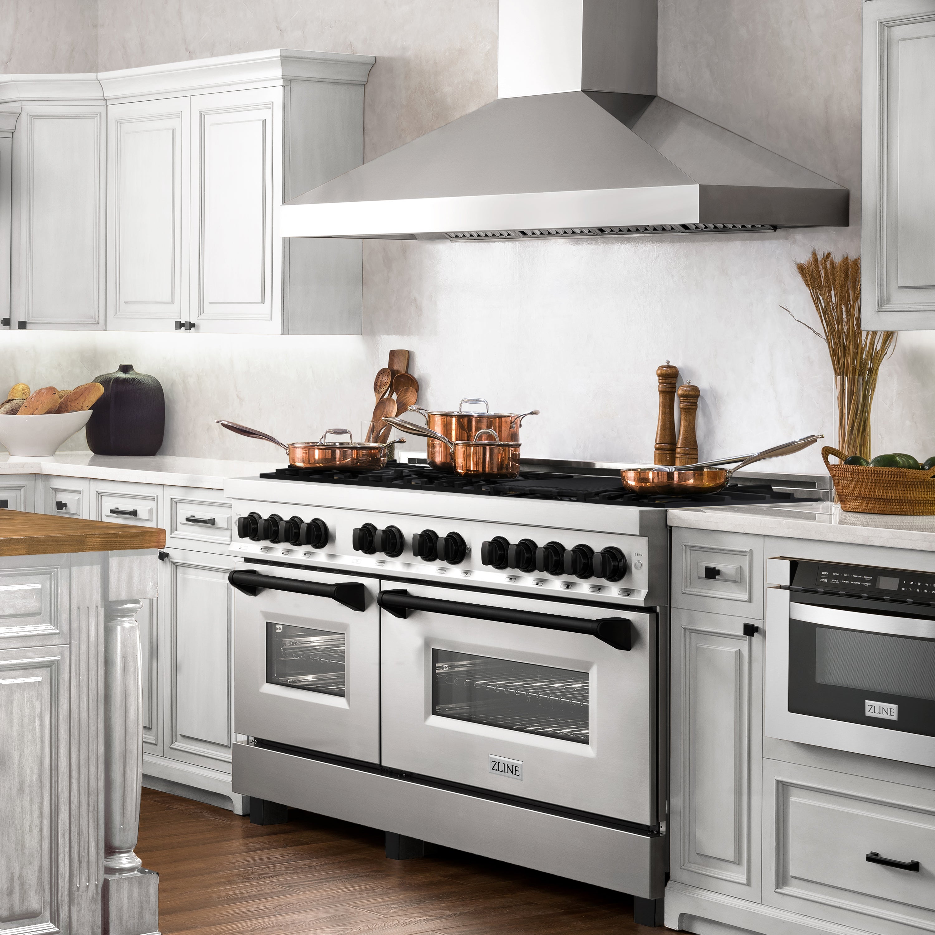 Dual-fuel range in stainless steel with black burner grates and two oven doors visible