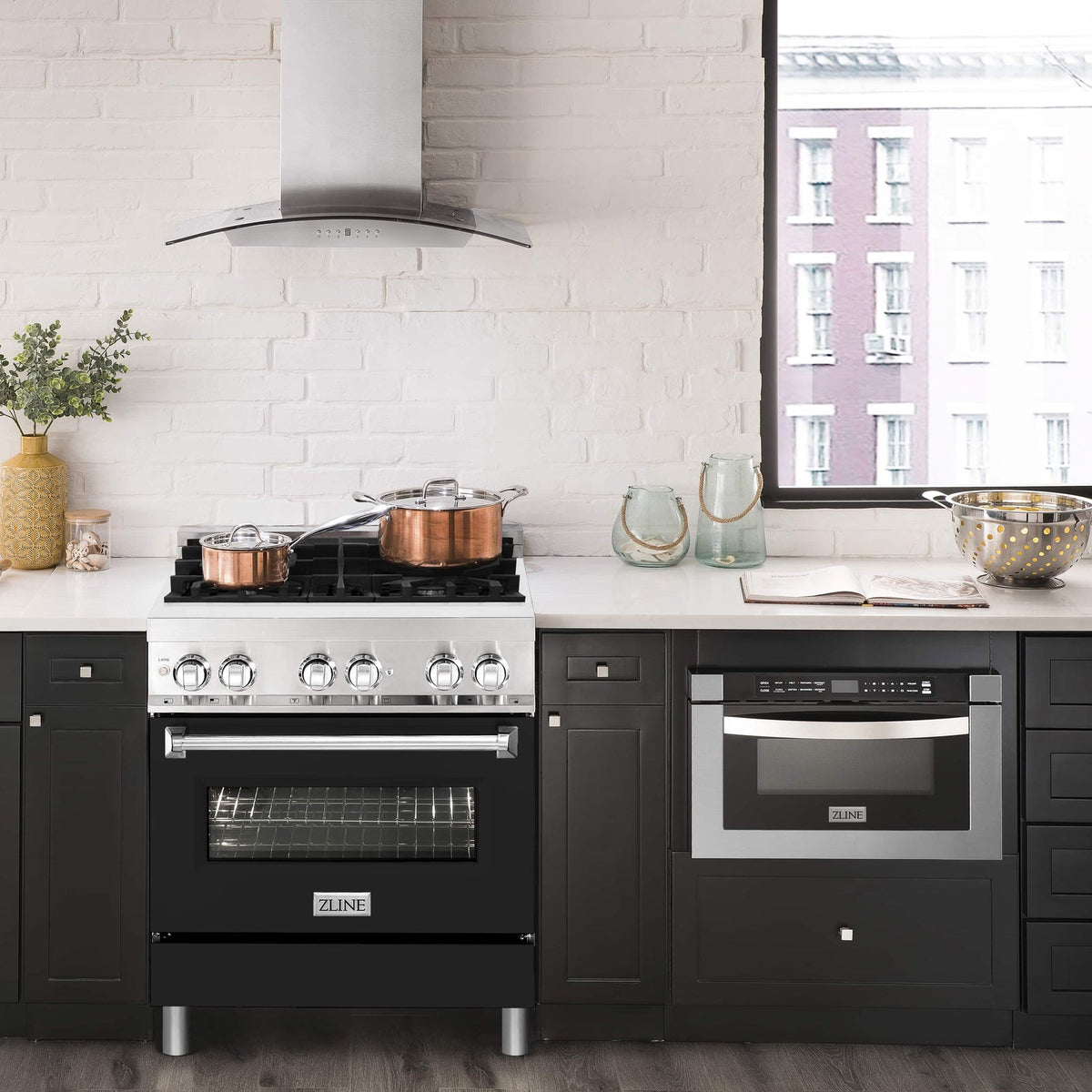 Stainless range hood over ZLINE dual fuel range with stainless front and black door