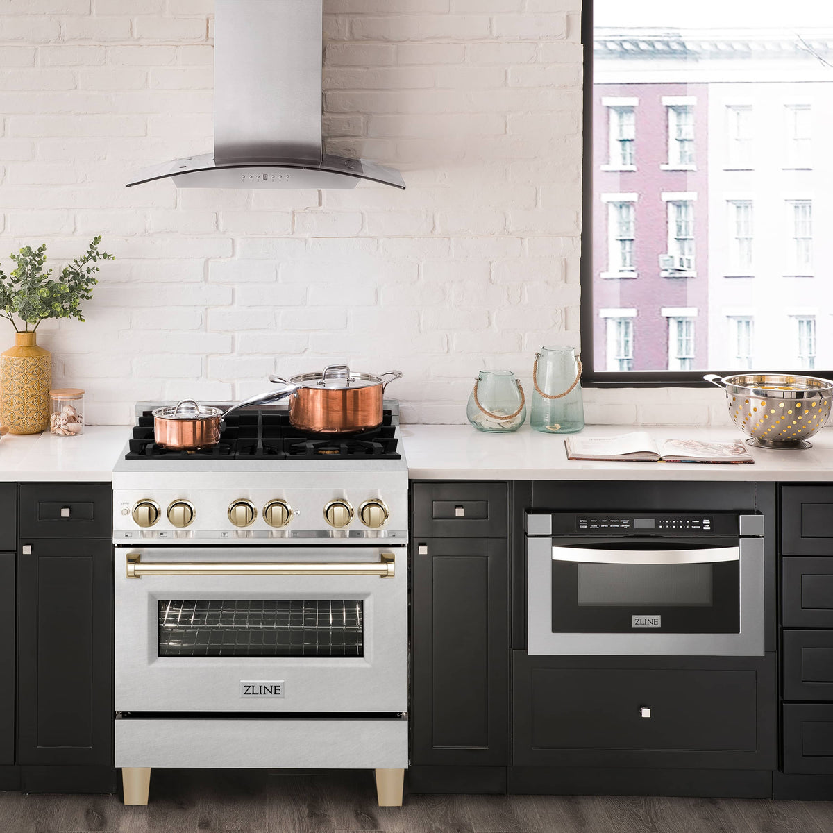 Fingerprint-resistant satin stainless range with gas cooktop, gold knobs, and oven door