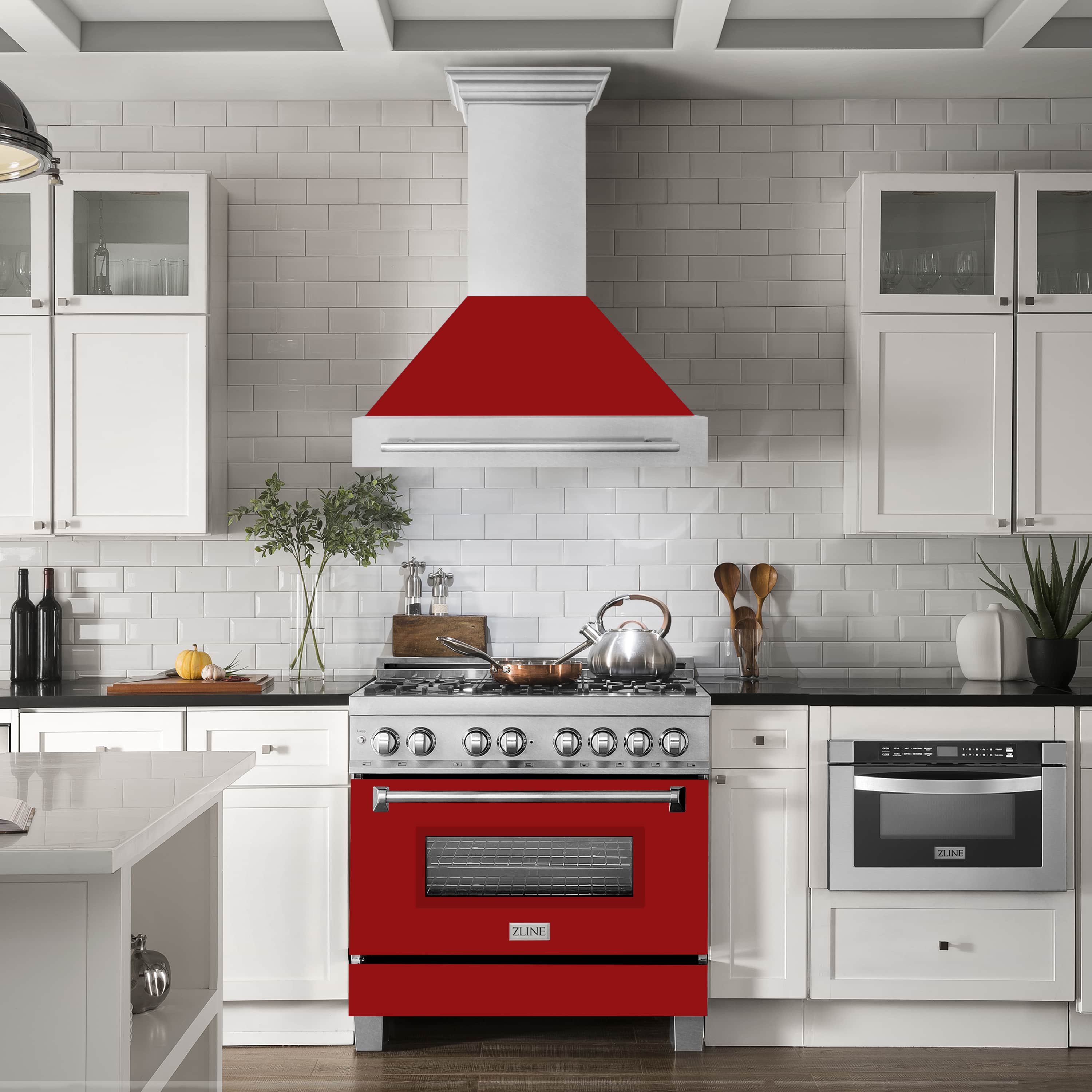 Wall mount range hood over stovetop with satin stainless chimney and red matte shell.