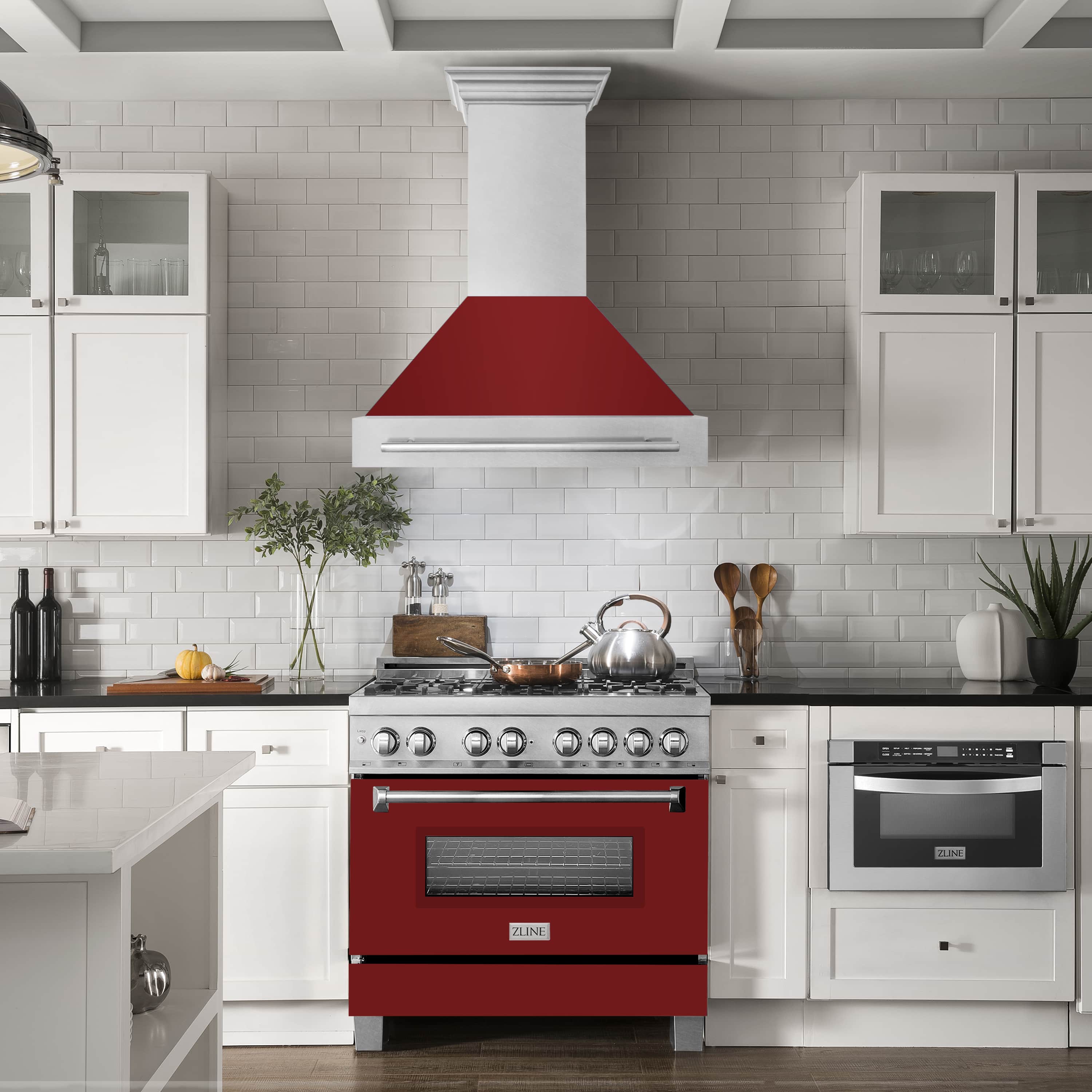 ZLINE wall mount range hood in satin stainless with red glossy hood shell above a kitchen stove