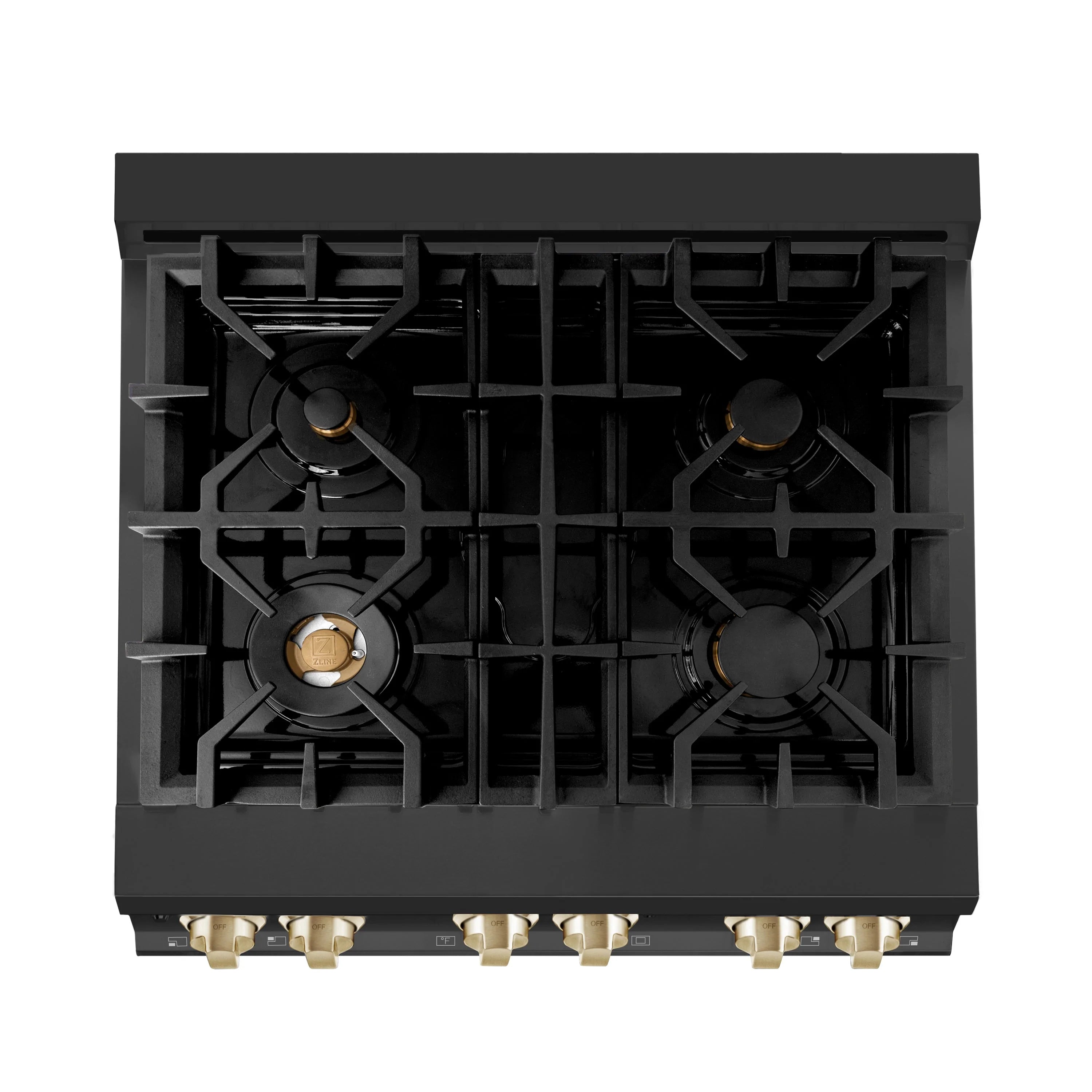 Black gas cooktop with four burners and gold burner caps