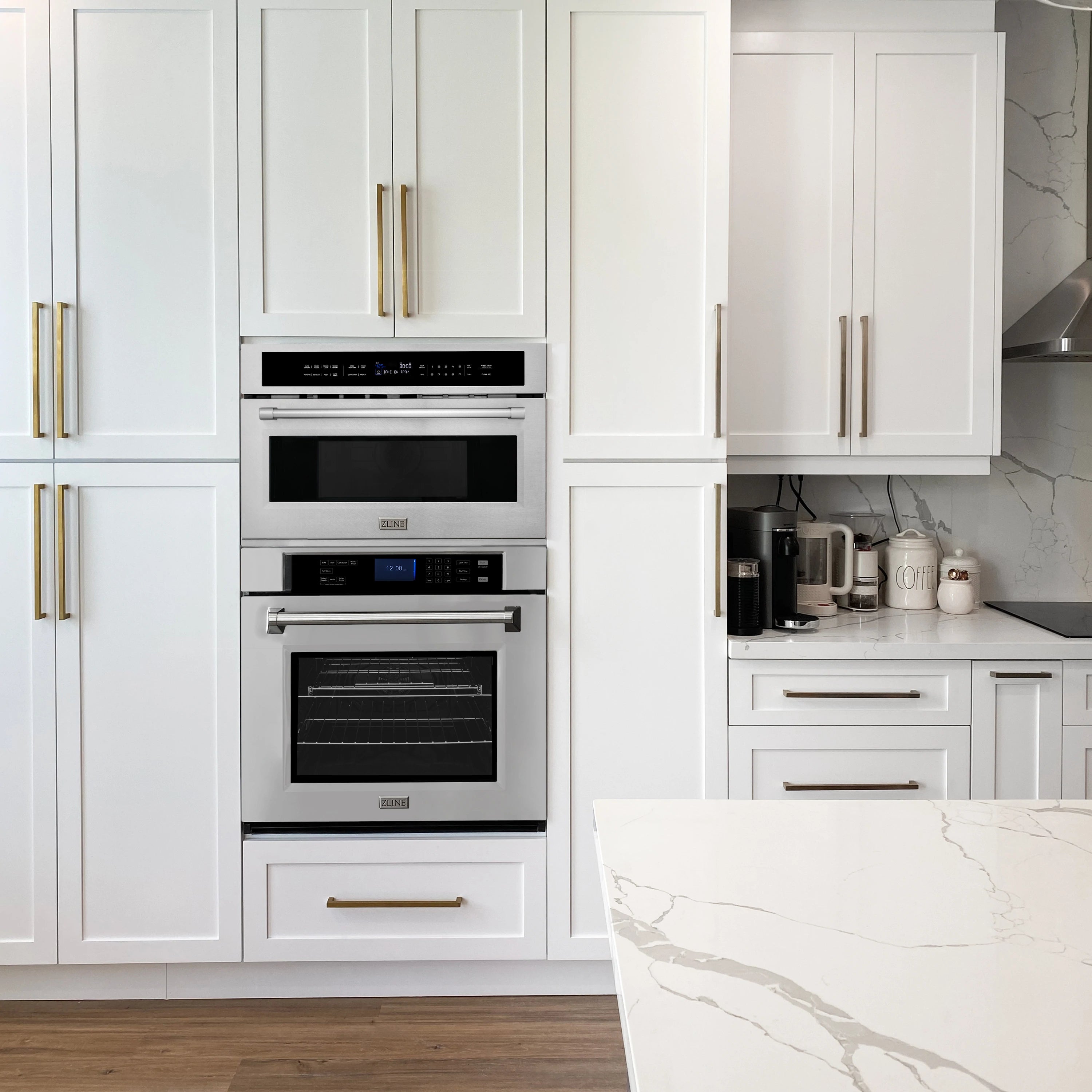 Built-in double wall oven set with stainless trim and black glass doors in kitchen