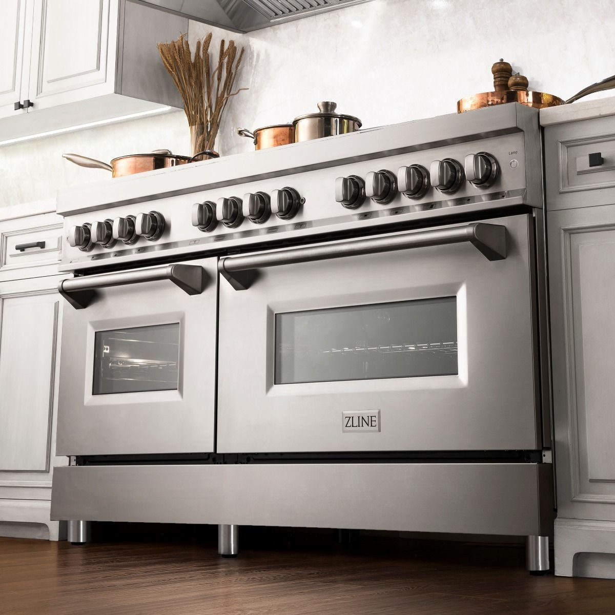 Stainless dual-fuel range with two oven doors, burner knobs, and front control panel