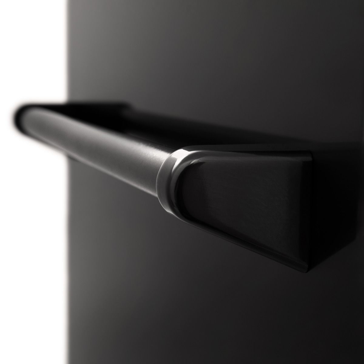 Close-up of metal handle on a black dishwasher door panel