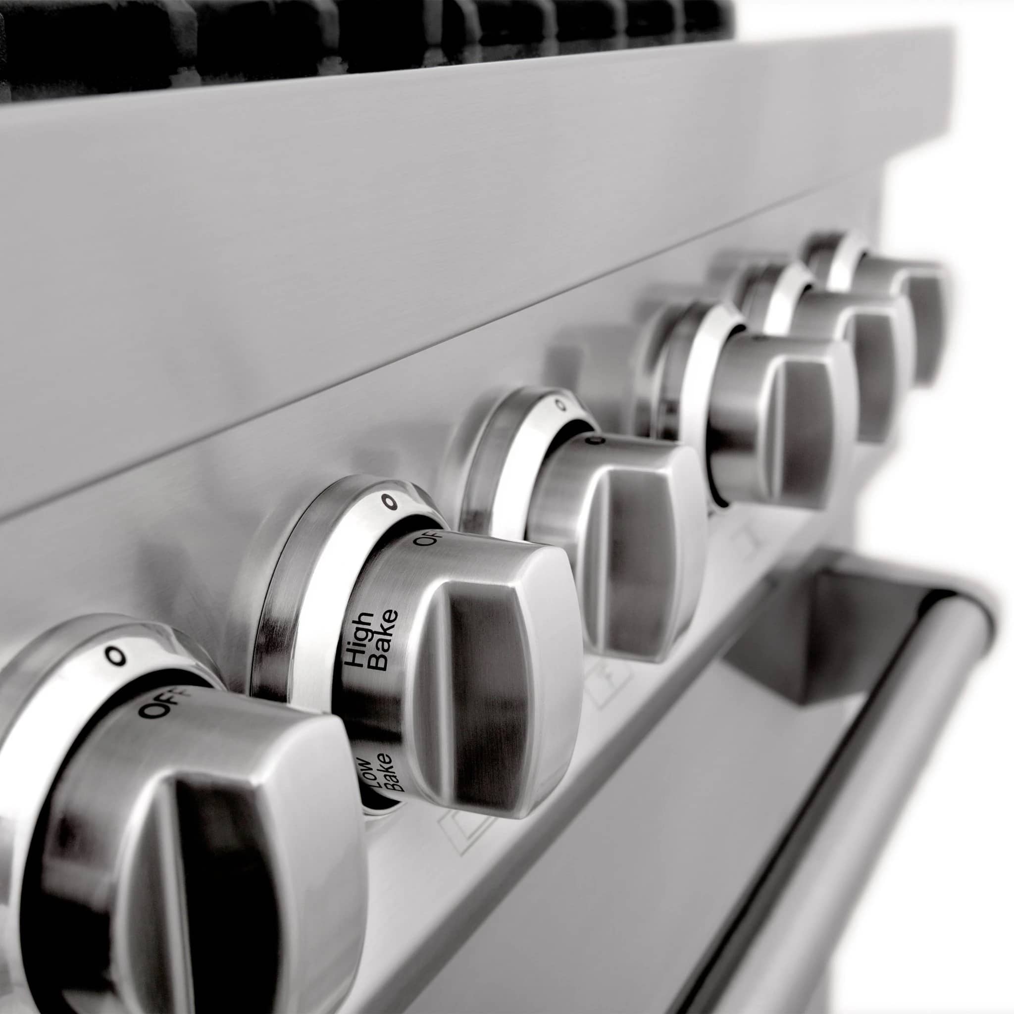 Stainless steel range control knobs and high-bake setting, close-up