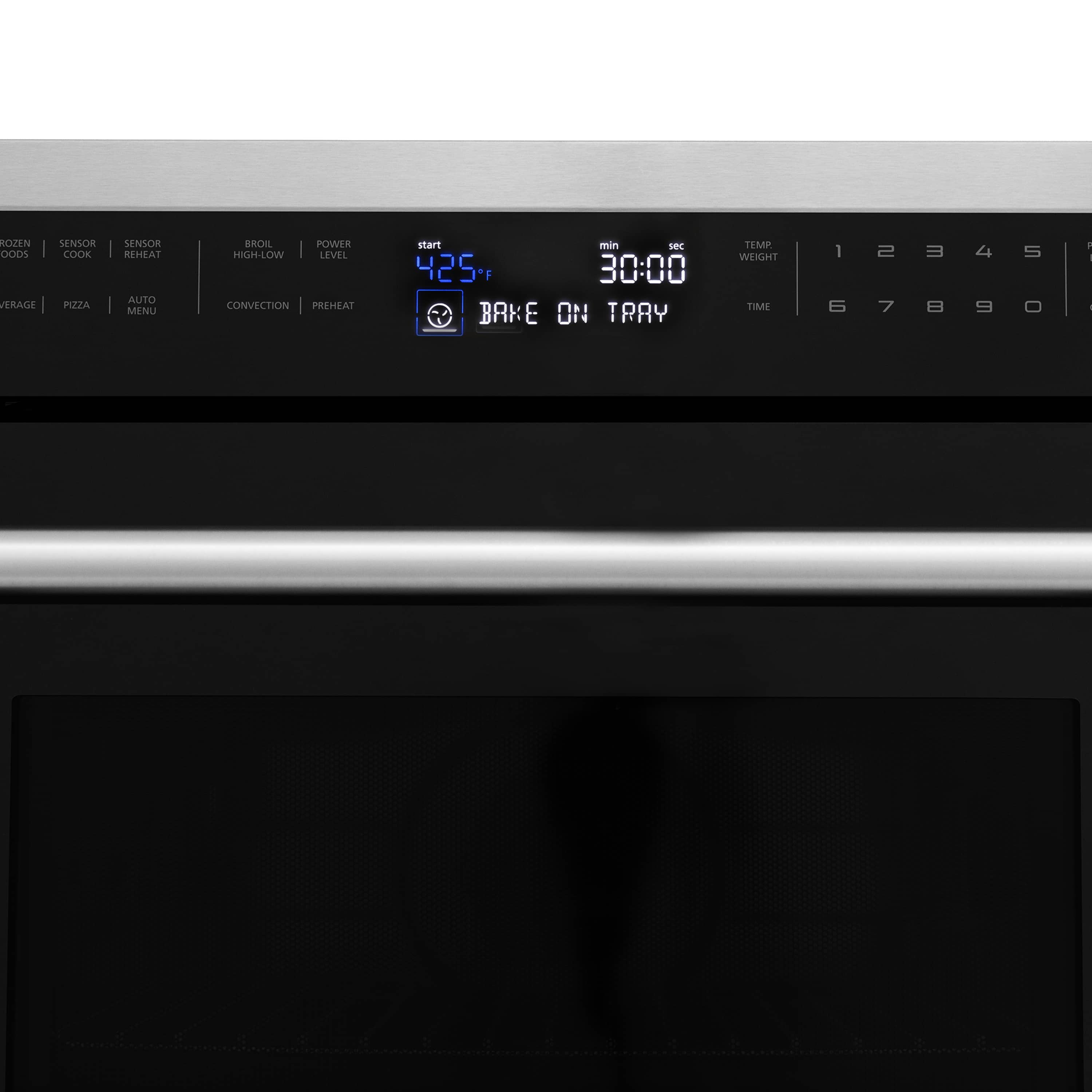 Microwave control panel with digital clock display and buttons above dark door