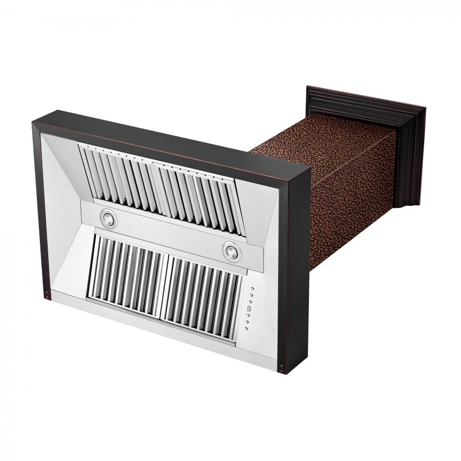 Wall range hood exterior with hammered copper chimney and stainless blower grille panel