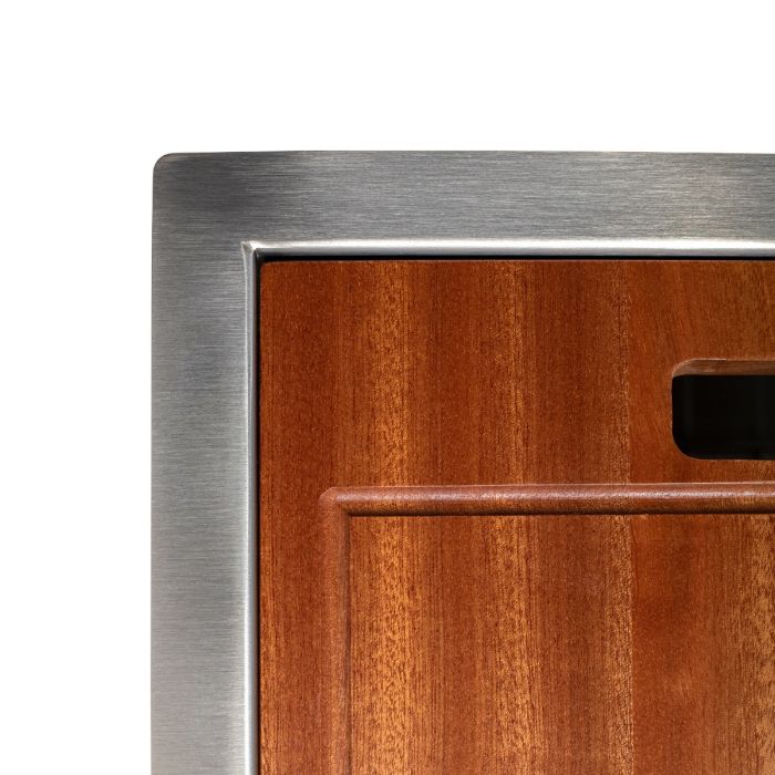 Stainless steel sink rim with wood cutting board insert at the sink opening