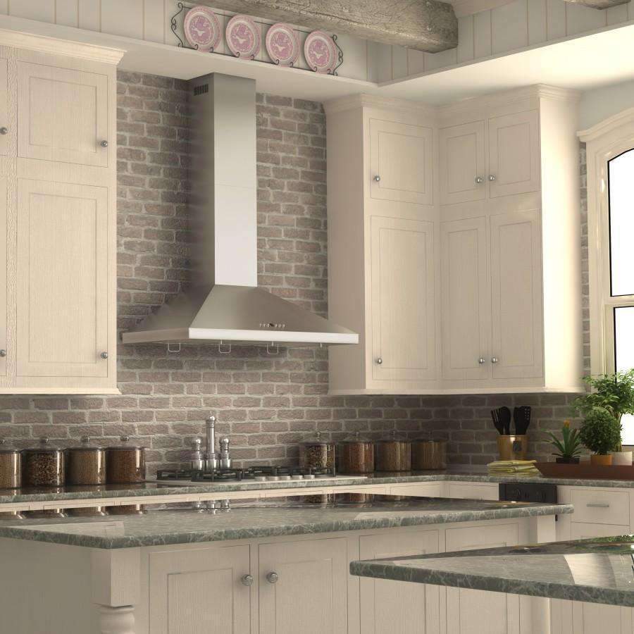 Stainless steel chimney wall mount range hood above gas cooktop