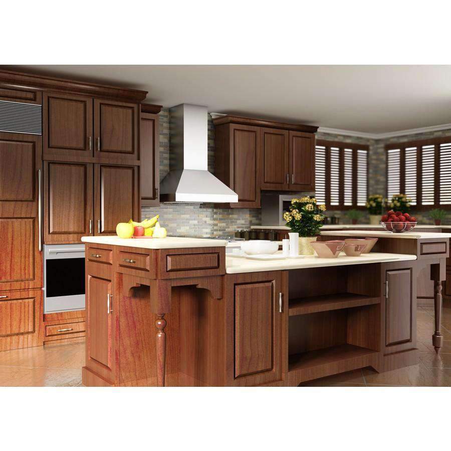 Stainless steel chimney range hood above stovetop in a kitchen