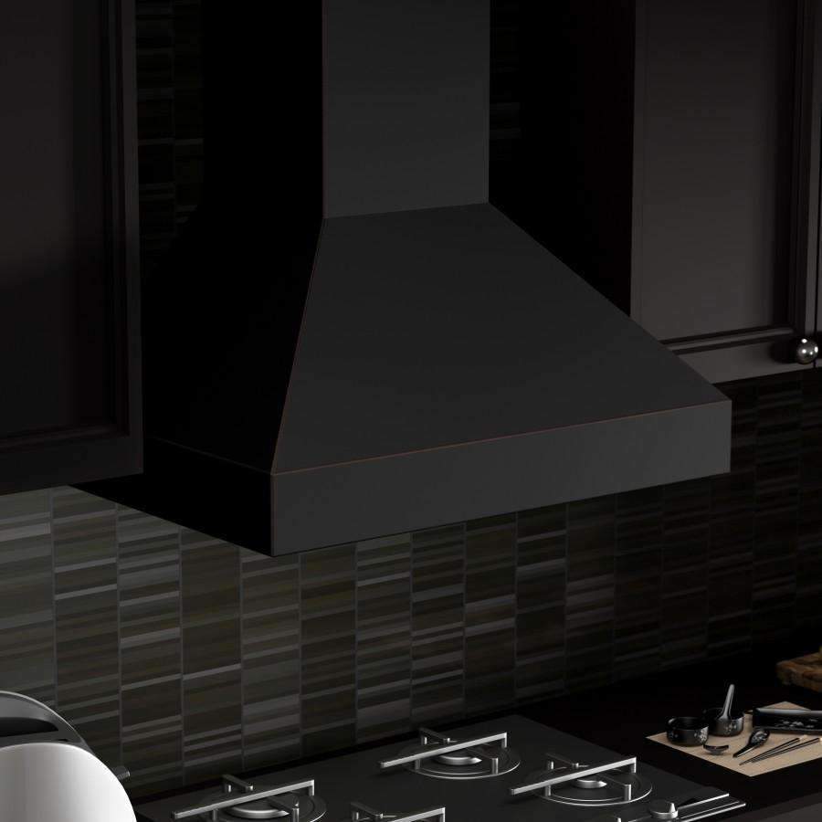 Wall range hood chimney and canopy in dark finish above a cooktop