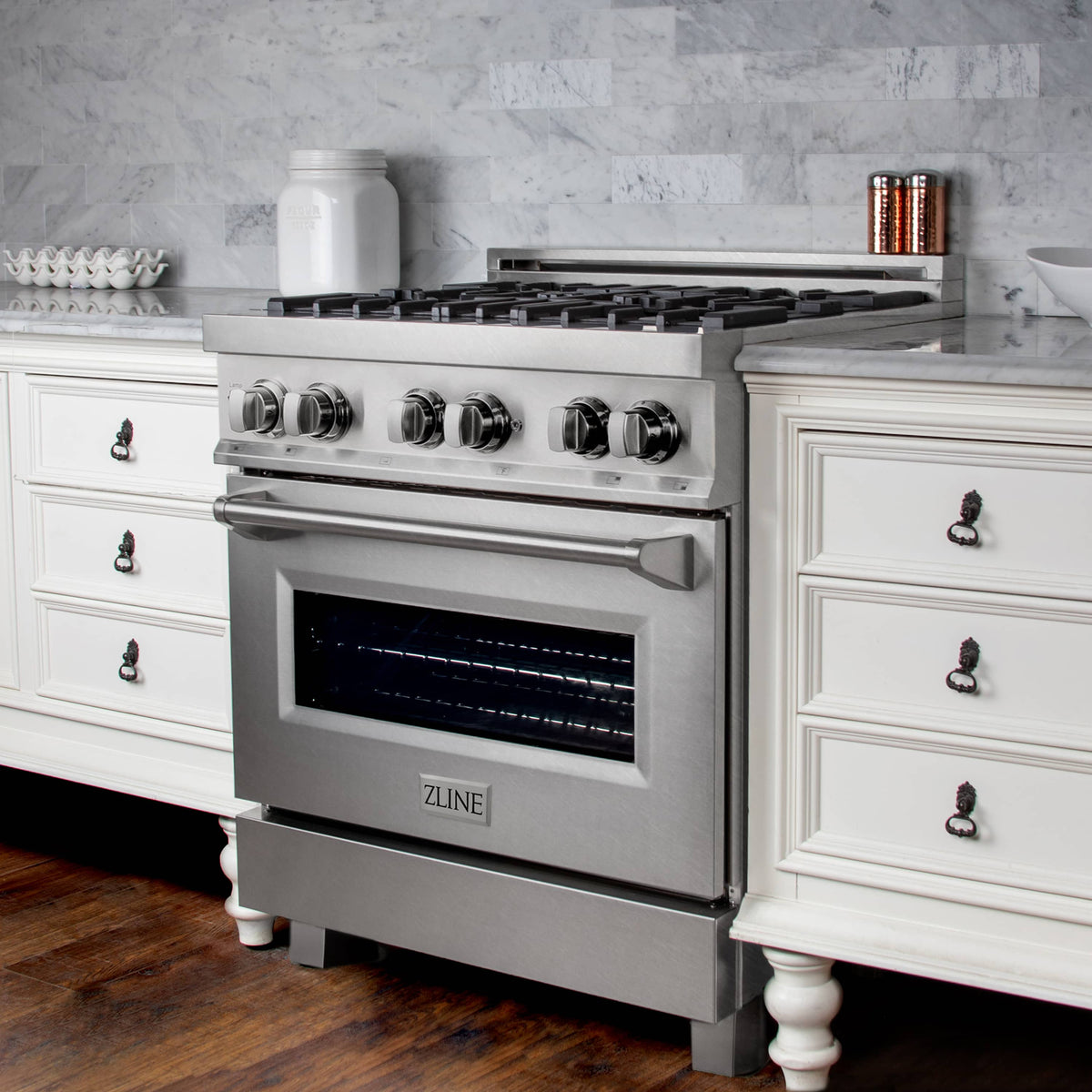 Fingerprint-resistant satin stainless steel dual fuel range with oven door and knobs