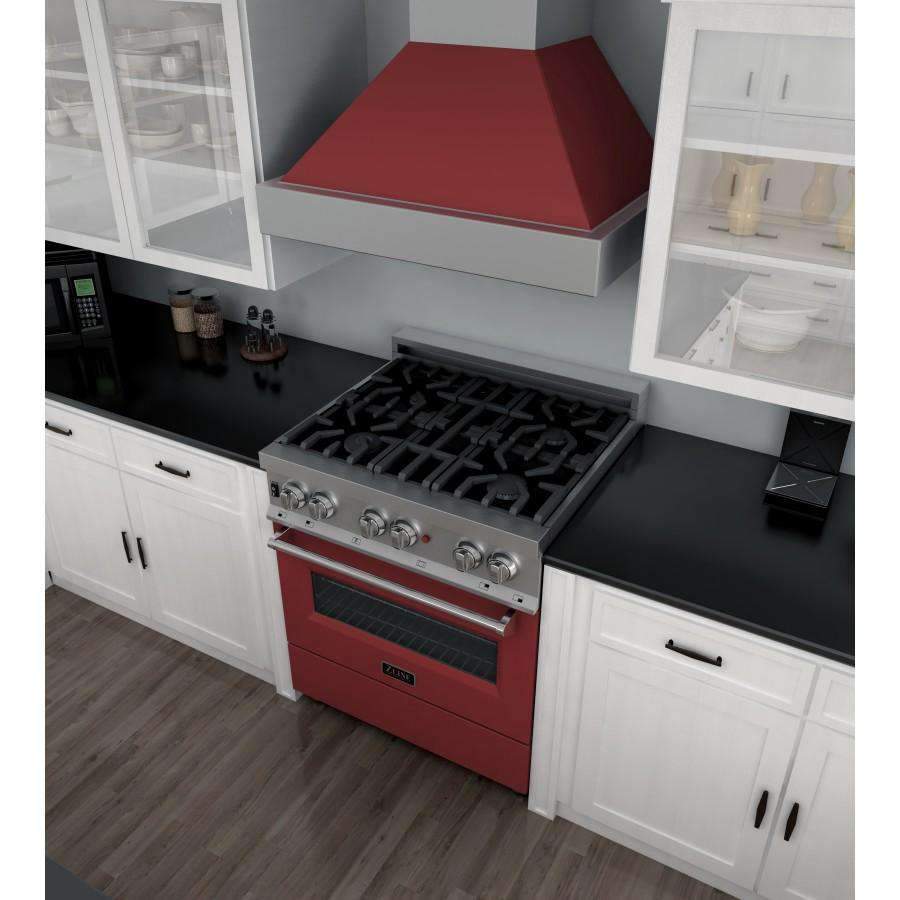 Dual-fuel range with black cooktop grates and open red oven cavity