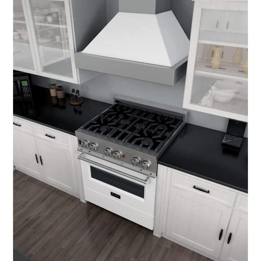 Dual fuel range cooktop with black grates, stainless control knobs, and white oven door.