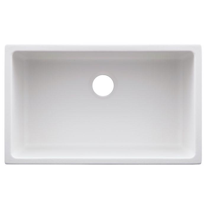 Matte white rectangular sink basin with round drain opening in center