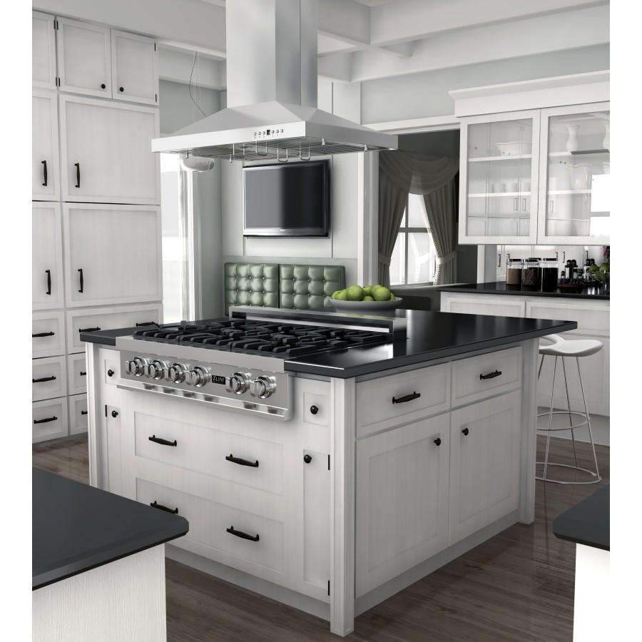 Stainless steel island range hood above a black cooktop, chimney and side filters visible.