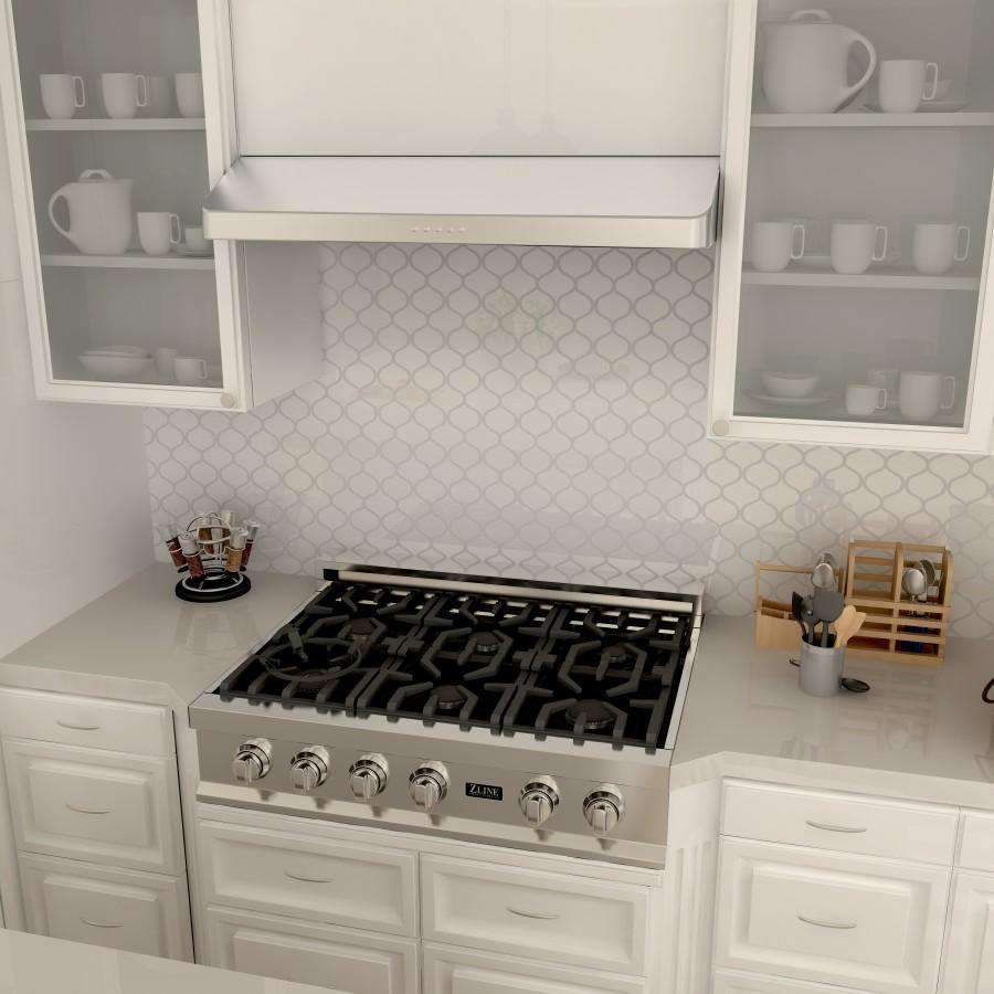 Stainless under-cabinet range hood over gas cooktop with burner grates