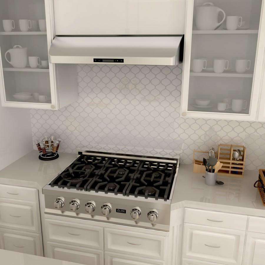 Under-cabinet range hood installed over a gas cooktop with front control panel
