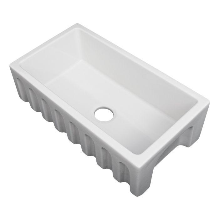 White apron-front single-bowl fireclay sink with drain hole