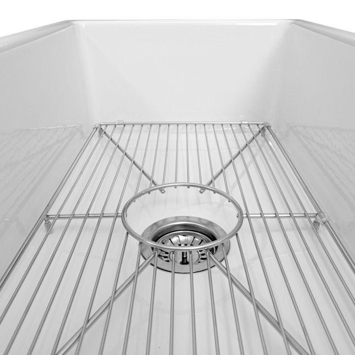 White sink interior with chrome bottom grid and center drain