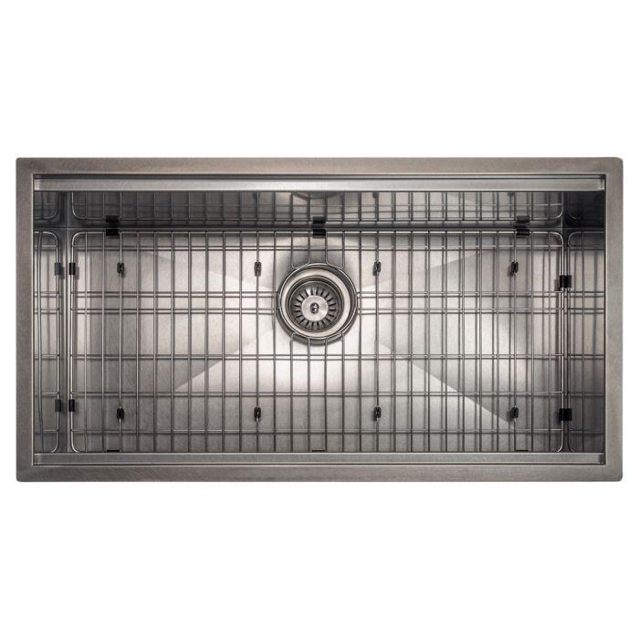 Stainless steel sink with installed bottom grid and center drain strainer